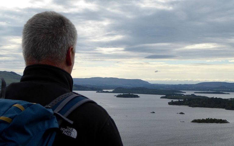 a man looking out over loch lomond