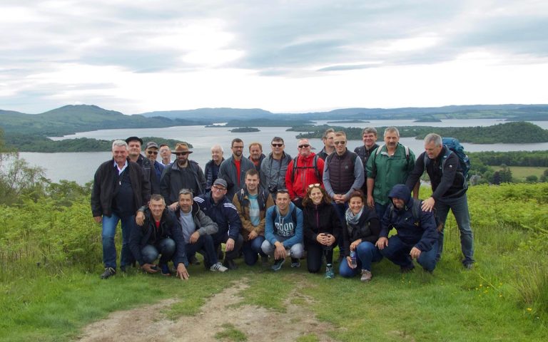 a group on a guided hike over looking loch lomond