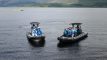 A corporate group on two speedboats at Loch Lomond
