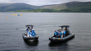 A corporate group on two speedboats at Loch Lomond