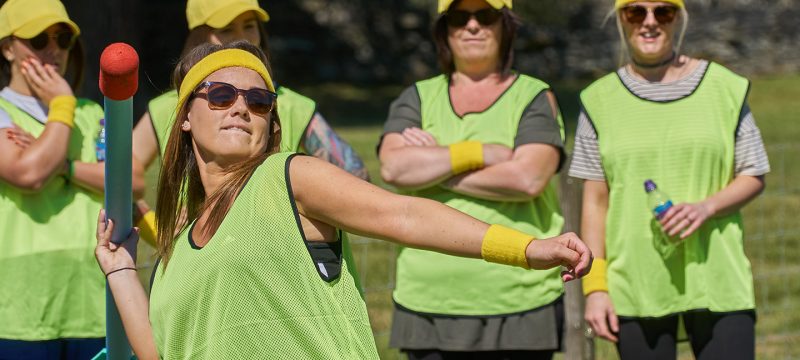 A Woman throwing a javelin in a sports day event