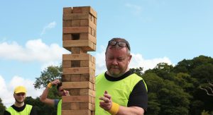Man playing giant jenga